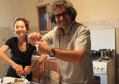 Yves M. Larocque and Monica Marquez cooking during our art classes in Tuscany