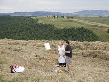 Prof. Yves M. Larocque with a student painting in Tuscany during Walk the Arts art courses in Italy