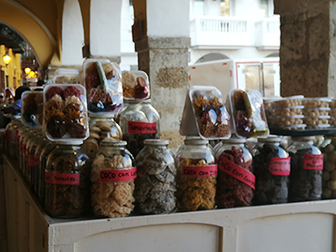 Jars with sweets and cocadas in Cartagena during Walk the Arts art workshop in South America also a culinary tour in Colom bia