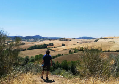 Prof. Yves M. Larocque in front of a view of the Val d'Orcia getting ready for an art class in Italy