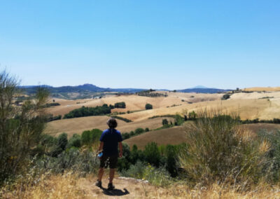 Prof. Yves M. Larocque in front of a view of the Val d'Orcia getting ready for an art class in Italy