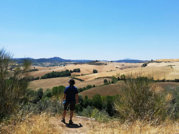 Prof. Yves M. Larocque in front of a view of the Val d'Orcia getting ready for an art class in Italy