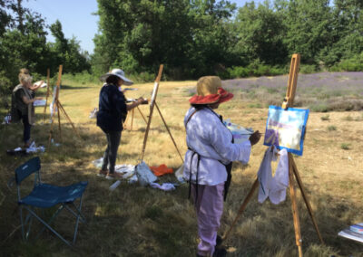 Artists painting in front of their easels painting in Provence during one of the art workshops in Southern France offered by Prof. Yves M. Larocque from Walk the Arts